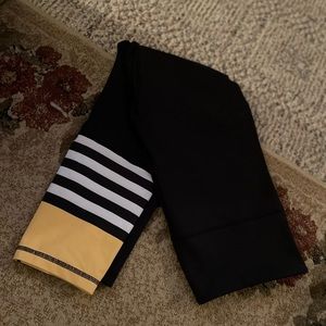 Size 12 Zyia leggings black with yellow and white lower leg